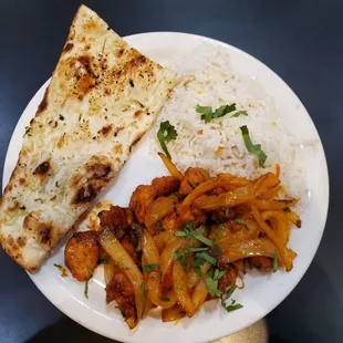 Mouth watering Chilli Chicken with Crispy Garlic Naan And fresh, fluffy rice.