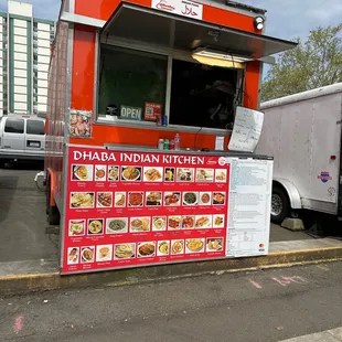 a food truck parked on the side of the road