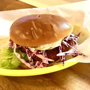 Vegan Spicy Big Cluckers- Nashville: Fried Nashville Chick&apos;n, Creamy Coleslaw, Lemon Mayo, Garlic Pickles, Lettuce