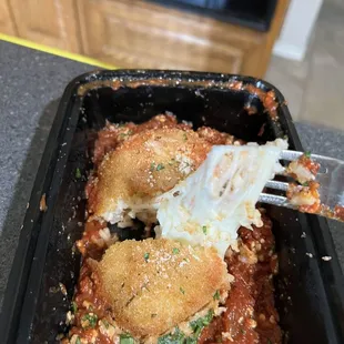 Stretchy, gooey cheese arancini