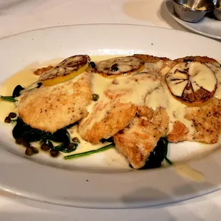 Chicken Limone on a bed of spinach, as part of the &apos;supper club&apos; pre-fixe. Delicious.