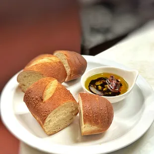 a plate of bread and dipping sauce