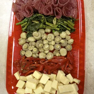 a platter of meat and cheese