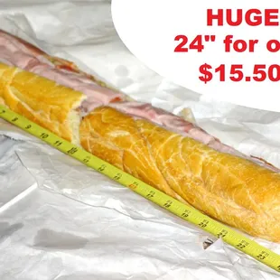 a huge sandwich wrapped in plastic