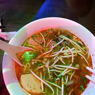 a bowl of soup with a spoon in it