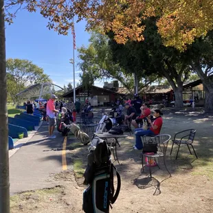 Driving range with clubhouse in background