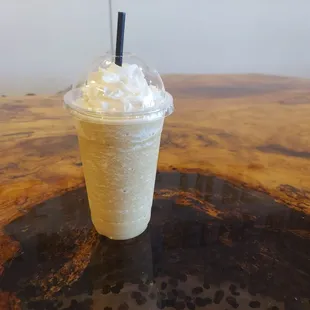 a cup of coffee with whipped cream