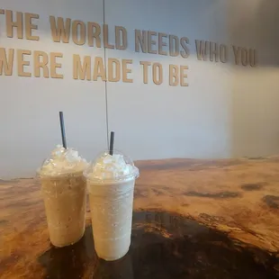 two milkshakes on a table