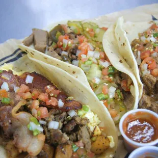 Fully loaded, Brisket, and Carne Guisada tacos!