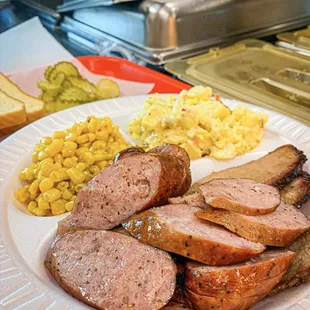 Two meat plate with brisket and sausage, and two sides of corn and potato salad!