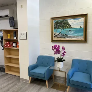 two blue chairs in a waiting area