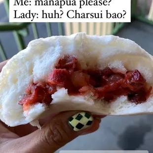 a person holding a piece of food