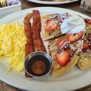 Belgium Waffles with Nutella, strawberries, 2 bacon and eggs (I chose scrambled)