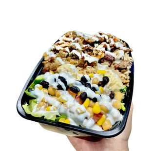 gyro over rice Mediterranean salad. 

-sauces: our signature 
 white sauce, hot sauce, BBQ sauce