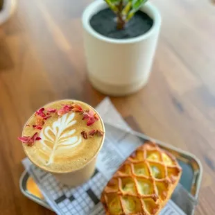  a cup of coffee and a pastry