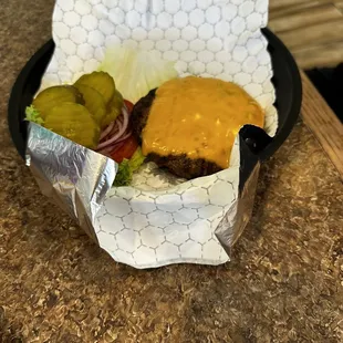 a cheeseburger and pickles