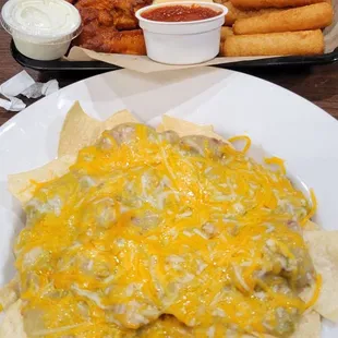 The Sampler Platter in the back and Nachos in the front.