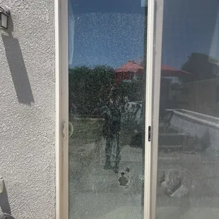 The broken sliding door.