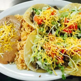 a plate of tacos and rice