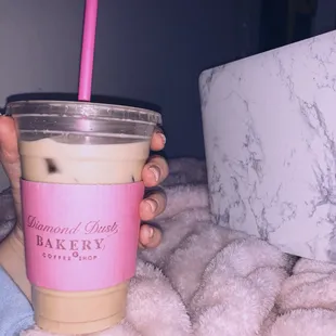 a person holding a cup of coffee