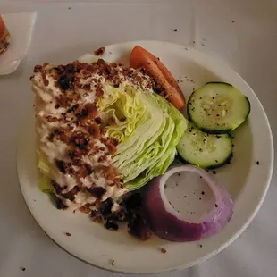 Wedge salad with house made thousand island dressing.  Bacon extra charge.