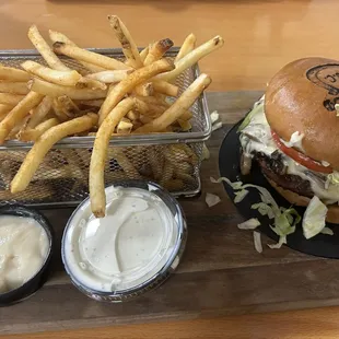 Seattle Slew burger with added lettuce and tomato, skinny fries