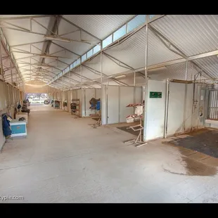 Inside the airy main stable with indoor and outdoor hot water wash and tack stations