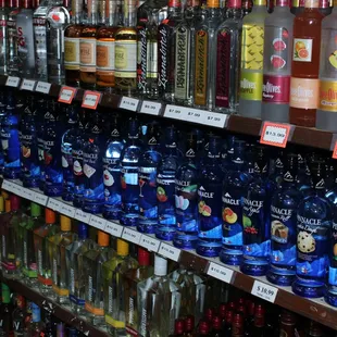 a variety of liquor bottles on a shelf