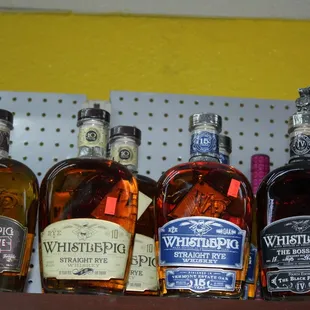 a variety of whiskeys on a shelf