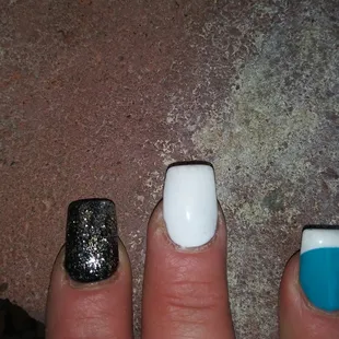 Middle finger not filed with acrylic on finger