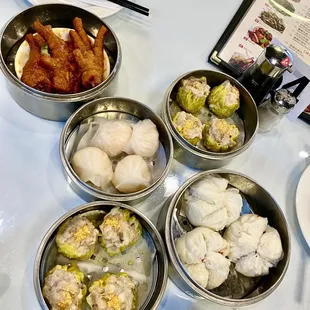 Pork Shumai, chicken feet, bbq pork steamed buns, shrimp har Gow.