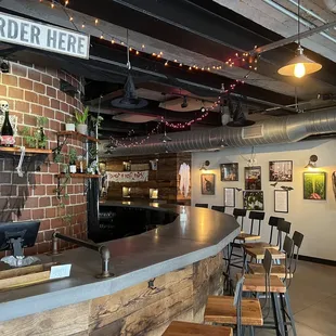 a bar with a brick wall