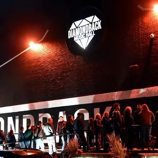 a crowd of people standing outside