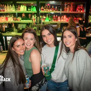 a group of women at a bar