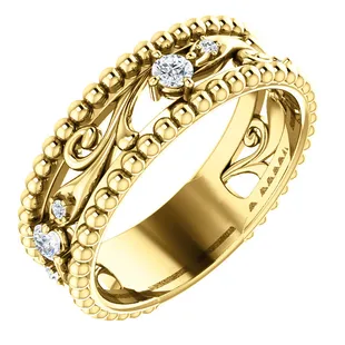 Wedding, anniversary, or fashion filigree ring accented with diamonds. Available in 14K ,18K, yellow or white gold.