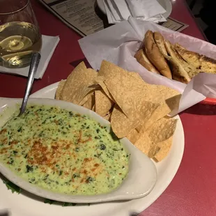 a bowl of dip and chips