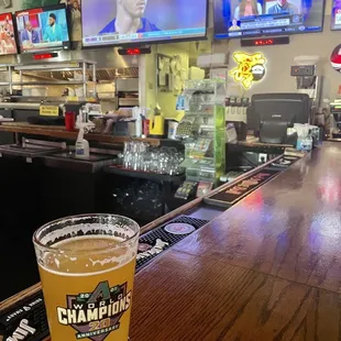 a pint of beer on the bar