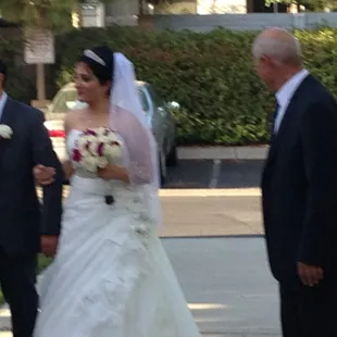The Bride and Groom arriving.