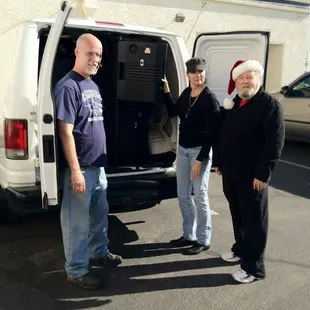 Ted, Diana, Johnny packing up an order for the caterers
