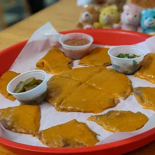 a plate of cheese and pickles