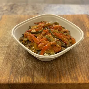 Ground picadillo bowl with white rice, beans, all the veggies and boss sauce.