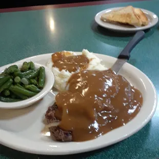 Very good hamburger steak in green beans mashed potatoes everything was hot refresh taste you