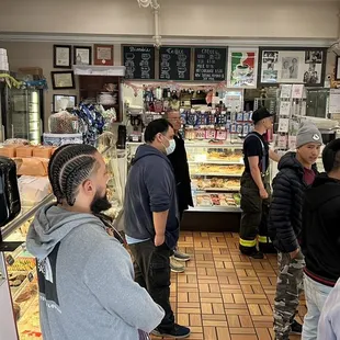 2023.5: post pandemic shop full of people, keeping respectable distance and queueing up outside on the street.