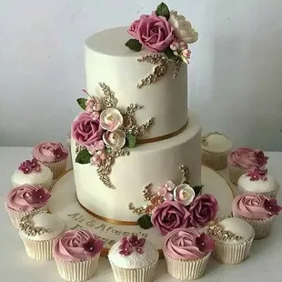 a wedding cake with cupcakes