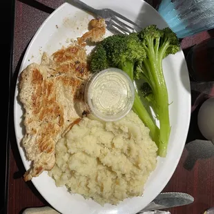 Grilled Chicken Breast with rice (except they got it wrong the first time with mashed potatoes.) and stalks of broccoli