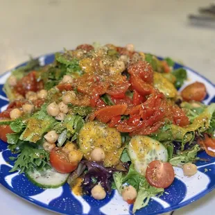 House Salad with Mixed Greens, Olives, Chickpeas, Cherry Tomatoes, Roasted Red Peppers, Cucumbers, and Oregano Vinaigrette