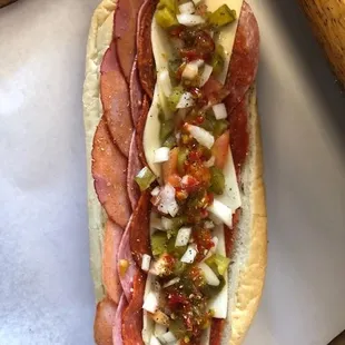 a hot dog with toppings