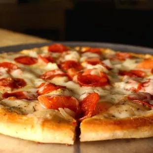 a pizza with pepperoni and cheese