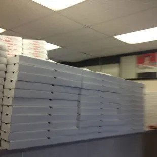 a stack of pizza boxes