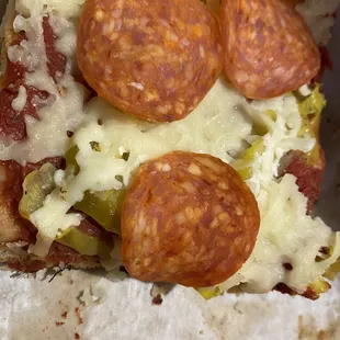 a slice of pepperoni and cheese pizza